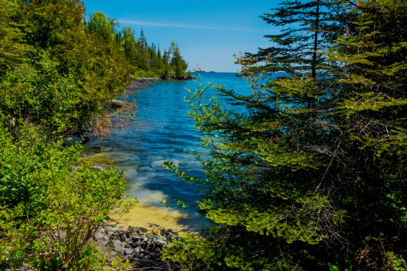 Isle Royale National Park on Lake Superior in Michigan with pine trees all along the coastline