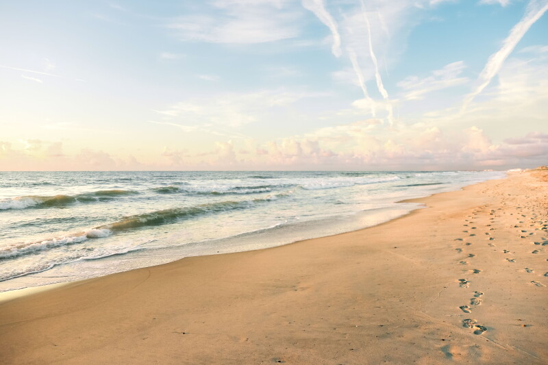 Sunrise at long, empty beach on Amelia Island