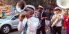Parading jazz musicians on Frenchmen Street in New Orleans lead a birthday party group.