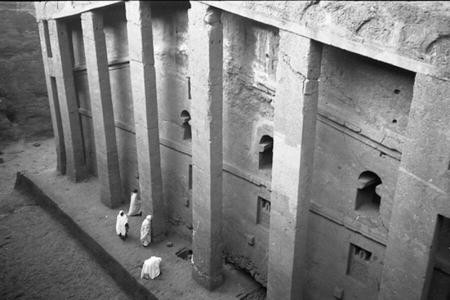 An image of worshippers entering the stone building of Lalibela in Ethiopia