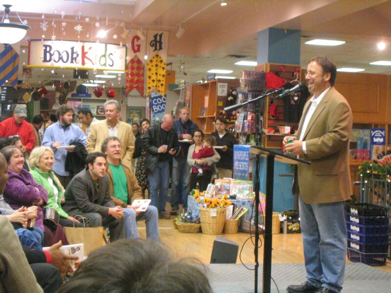 A person giving a talk in front of a crowd at BookPeople in Austin