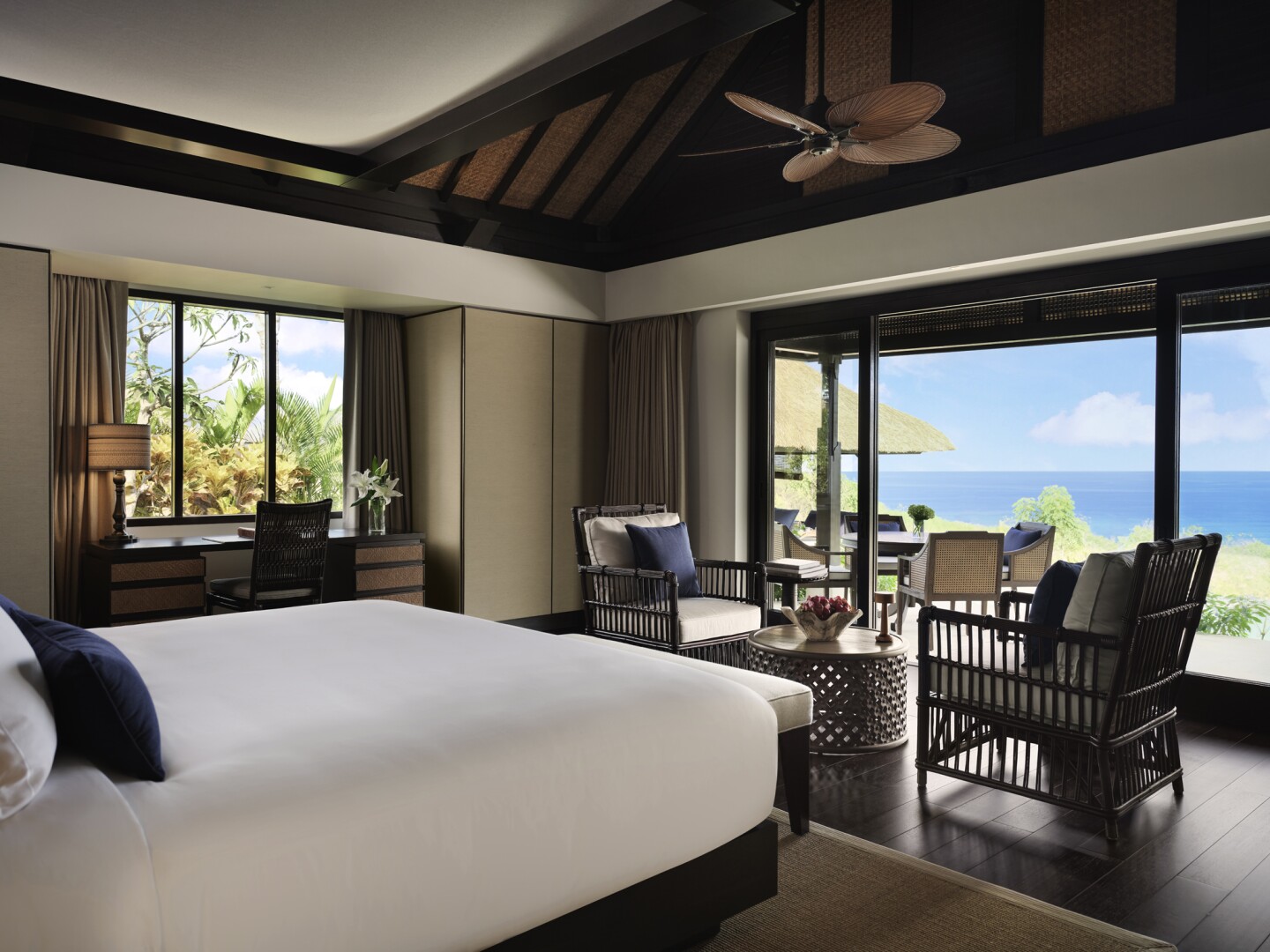 The guest rooms at the Raffles Bali feature rattan furnishings and verandas with ocean views.