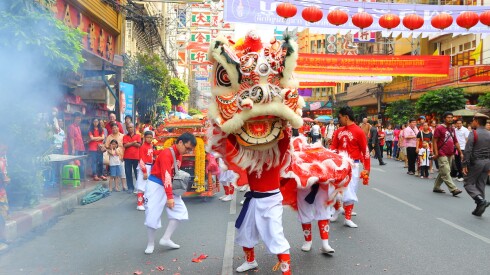 A lion dance in the streets of Bangkok's Chinatown