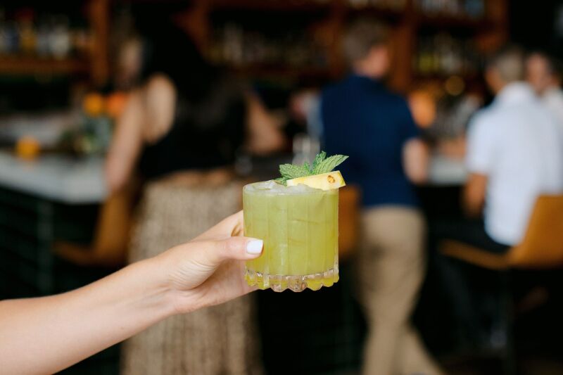 The Accident in Paradise at Pearl Social, a mix of tequila, pineapple, cilantro, and cucumber that you can convince yourself counts as a health tonic.