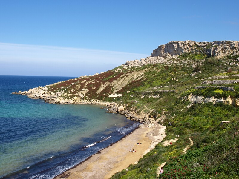 The family-friendly Ramla il Hamra is perfect for swimming and exploring nearby caves.