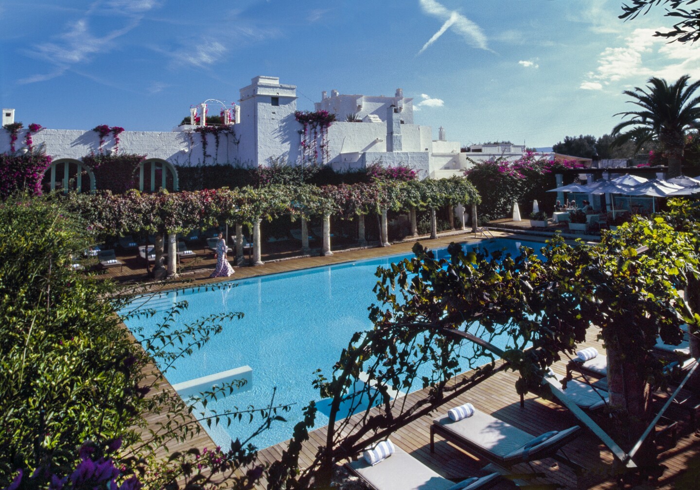 The pool at Masseria Torre Maizza is surrounded by columns