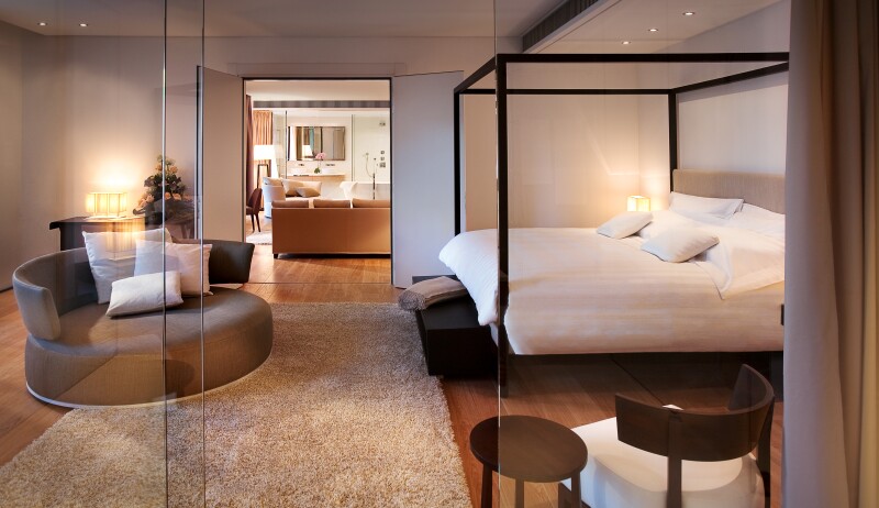 Accommodations at Principe Forte dei Marmi, with four-poster bed and large round sofa