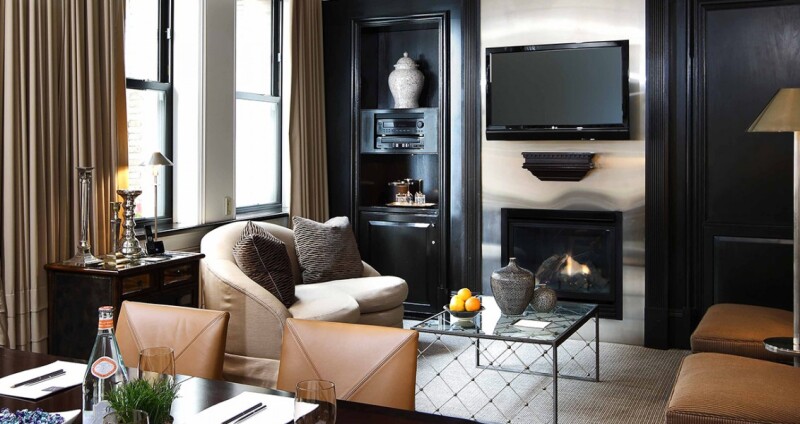 XV Beacon's guest rooms feature fireplaces and leather-covered seating.