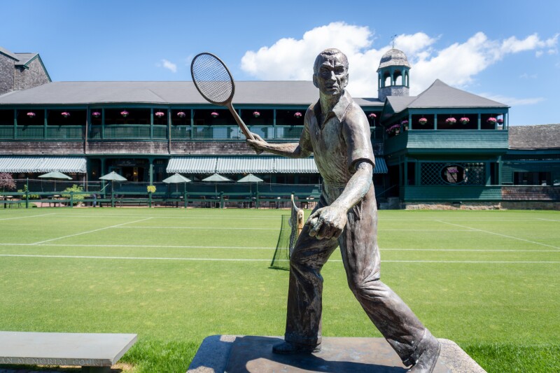 Outdoor statue of Fred Perry, Wimbledon tennis champion, at Newport Casino (in background)