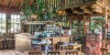 Empty chairs and tables in restaurant