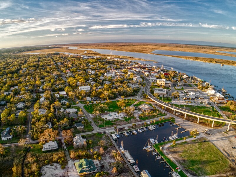 Bird's-eye view of a seaside town with small marina
