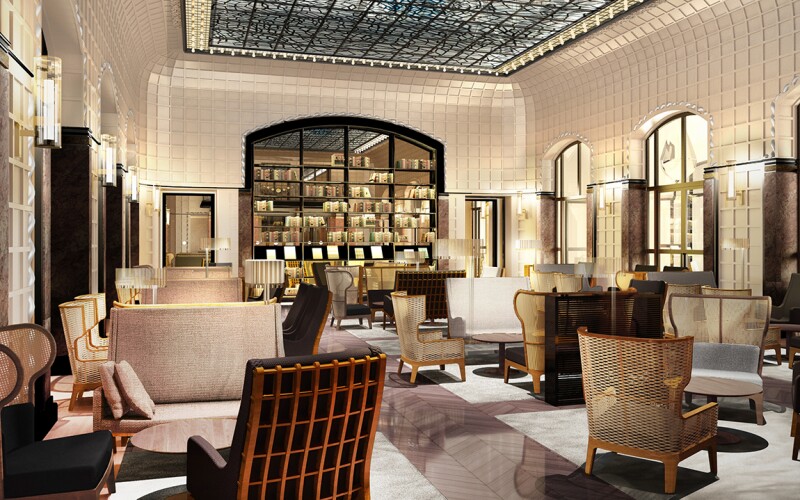 Hotel Lutetia features a lobby with tile walls and a glass ceiling, filled with lamps on the wall. Metal net chairs surrounded tables to encourage a talking environment. There is a large bar in the background