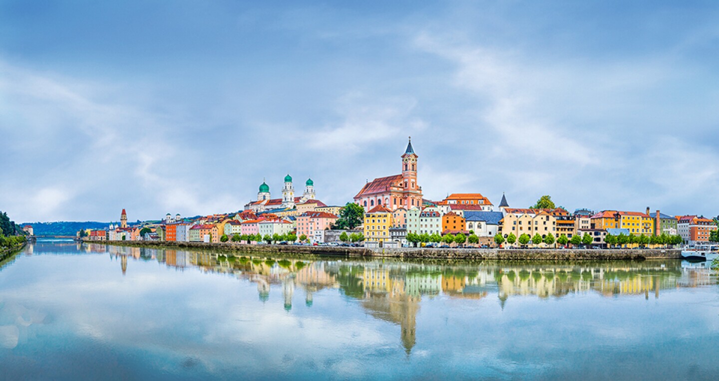 Colorful buildings reflecting on the water in Passau, Germany