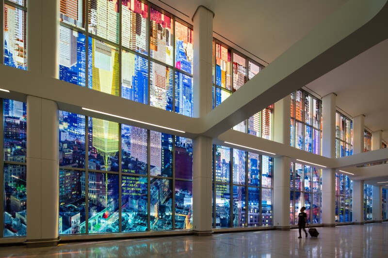 Among the many areas in which LaGuardia's Terminal B has stepped up its game are the art and design elements. Here, tall, colorful glass murals.