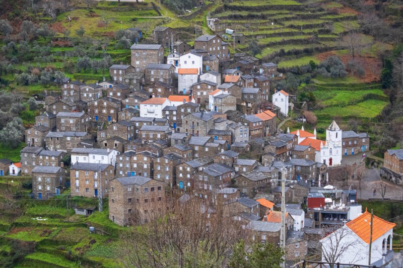 A group of slate and stone buildings