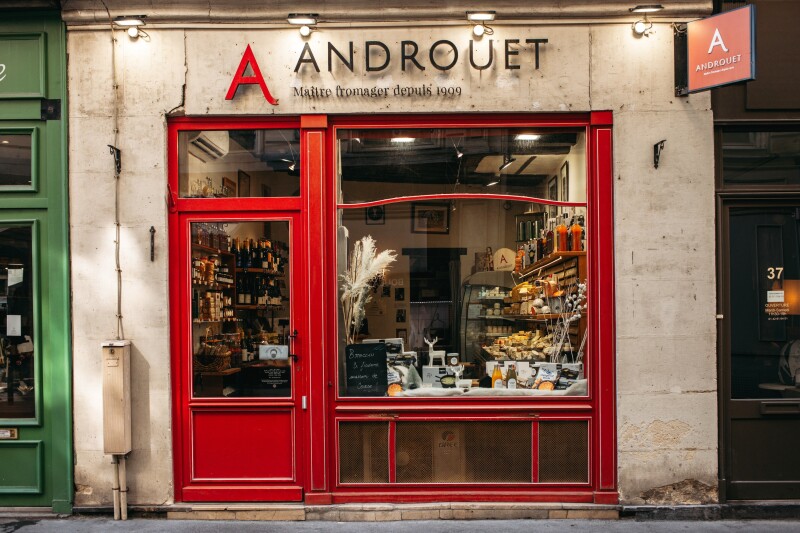 The red and white exterior of Androuet cheese shop