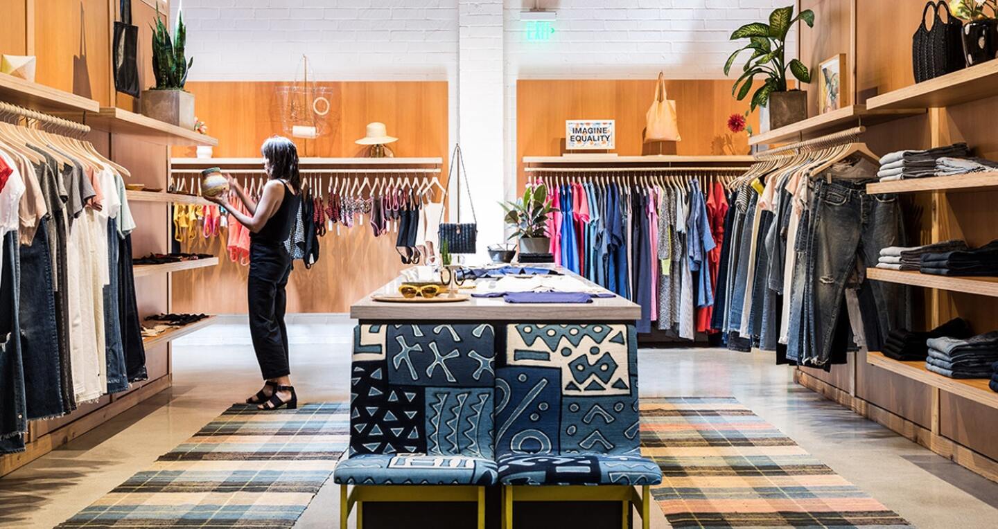 A woman looks at the only pot in a clothing store