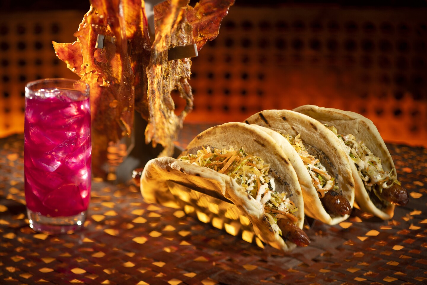 The Ronto Wrap piles roasted pork, grilled sausage, and tangy slaw in soft pita.