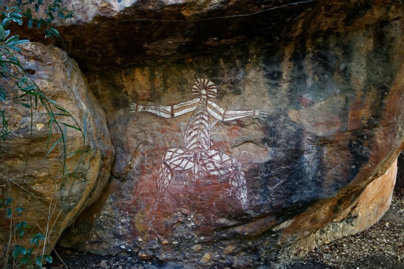 Aboriginal rock art in Kakadu National Park, with detailed white drawing of human figure