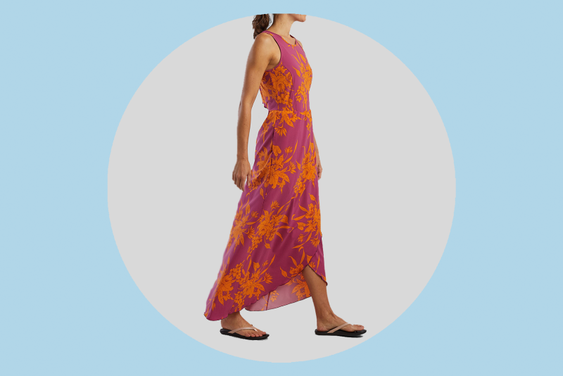 Woman wearing a pink and orange floral print maxi dress