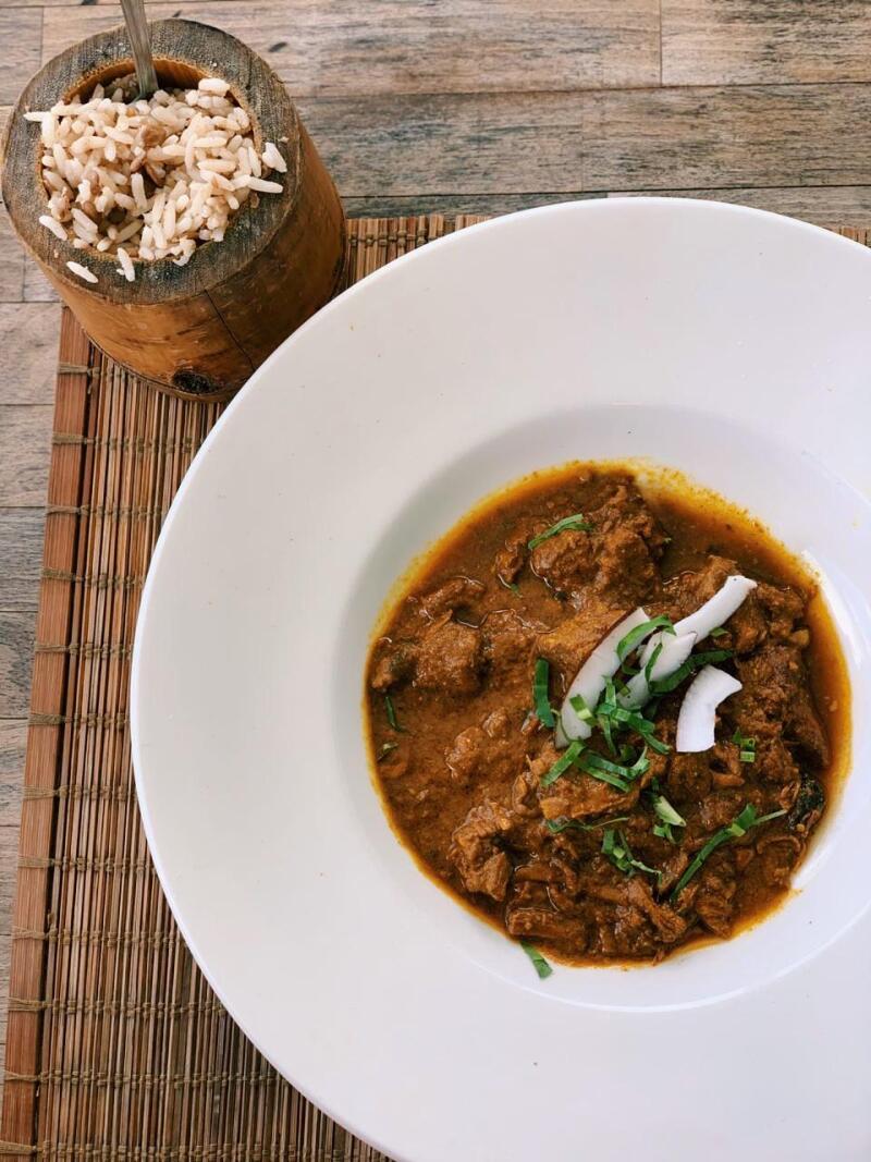 BB’s flavorful curry comes with slow-cooked goat and thin coconut shavings.