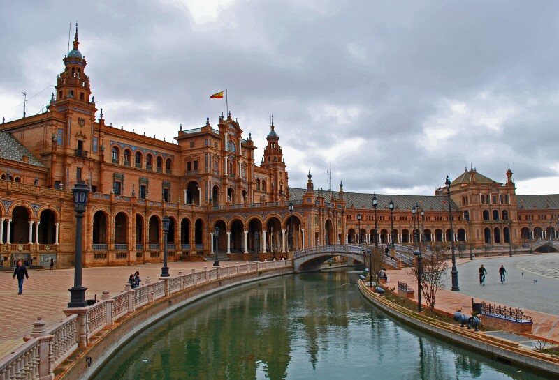 A riverside view of the Plaza de España in Seville