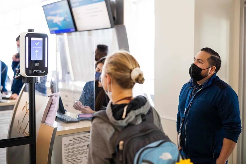 An Alaska Airlines passenger uses facial recognition to board a flight