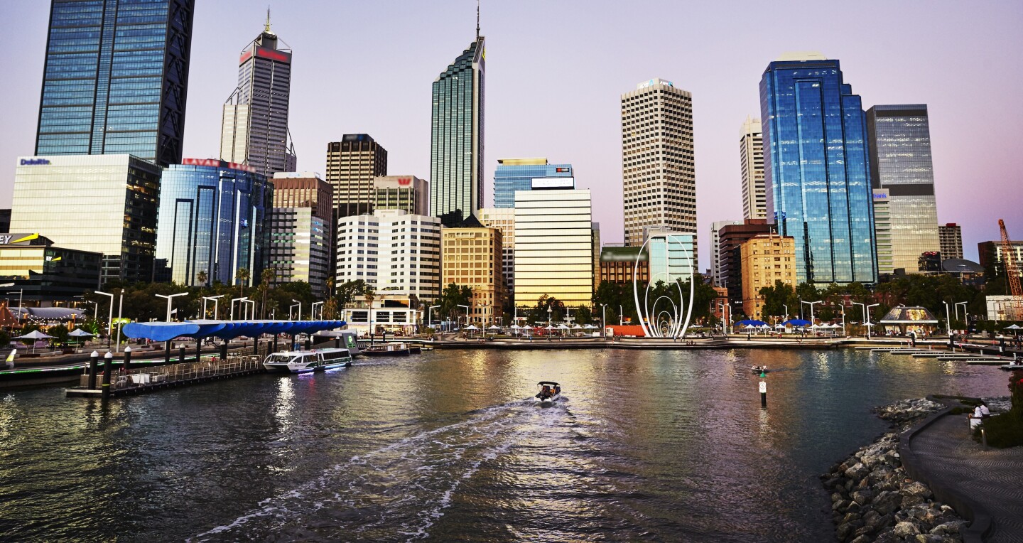 A view of the tall buildings along the water at Elizabeth Quay, Perth, Australia.