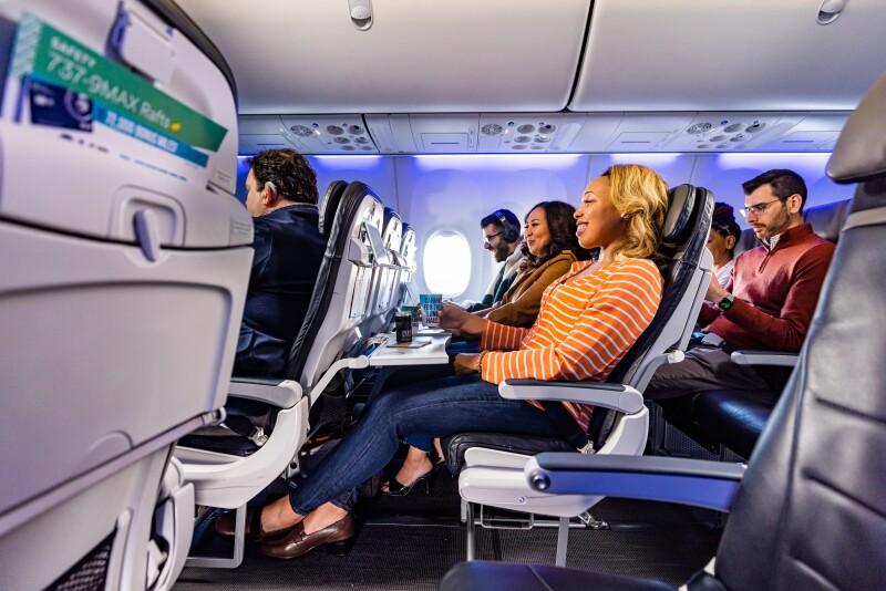 Passengers in Alaska Airlines' Premium Class seats