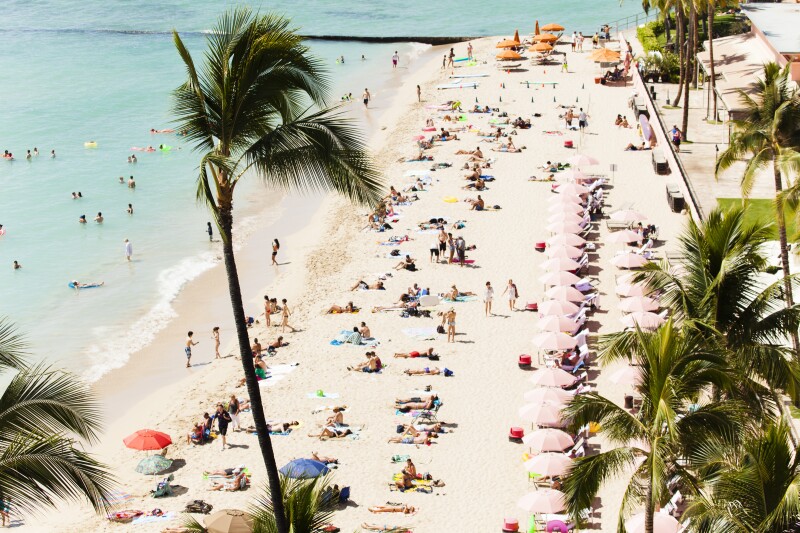 Lots of people on the beach in Honolulu, Oahu on a nice sunny day.