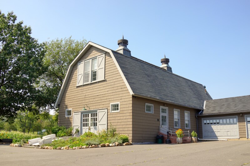 A reconstructed tan barn at Queens County Farm in Queens