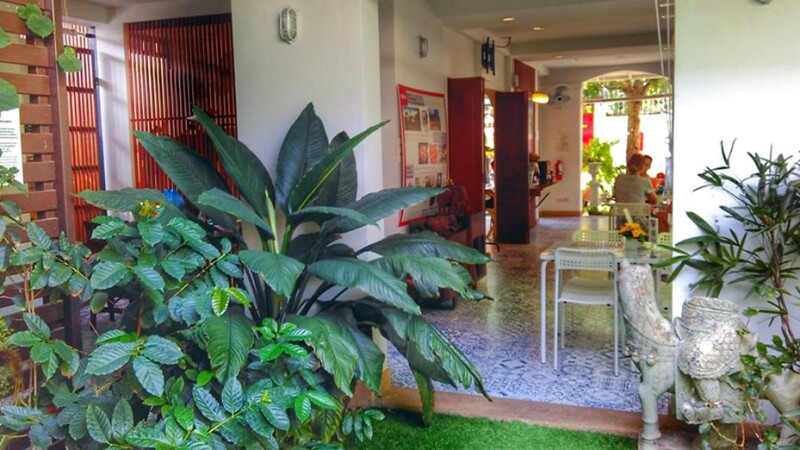 The azulejo-covered courtyard of the Baan Kudichin Museum