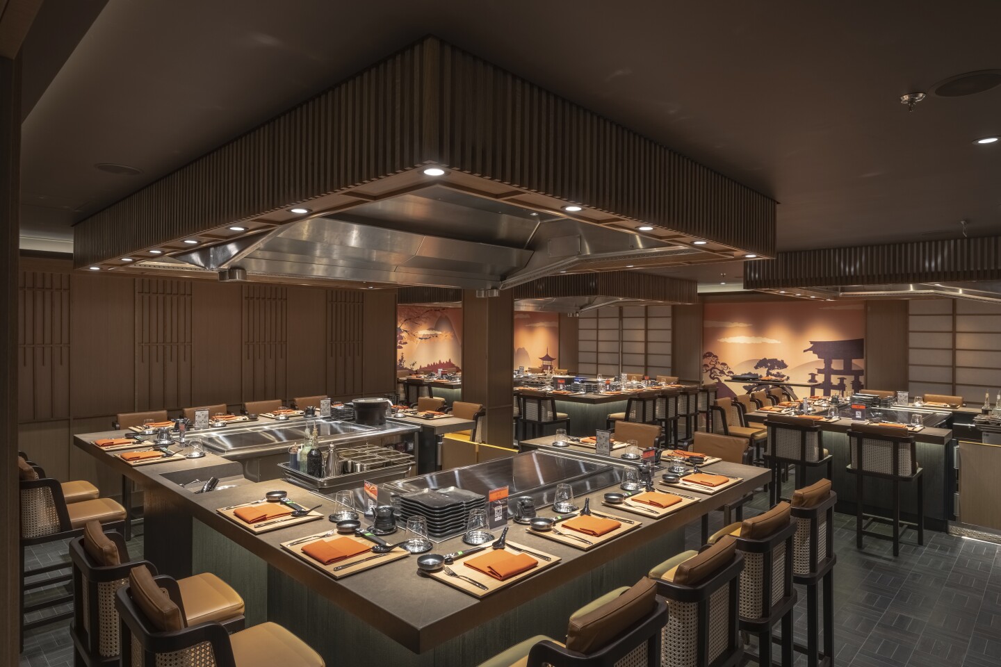 Kaito Sushi and Teppanyaki restaurant with individual grilling stations arranged in square and surrounded by dining chairs