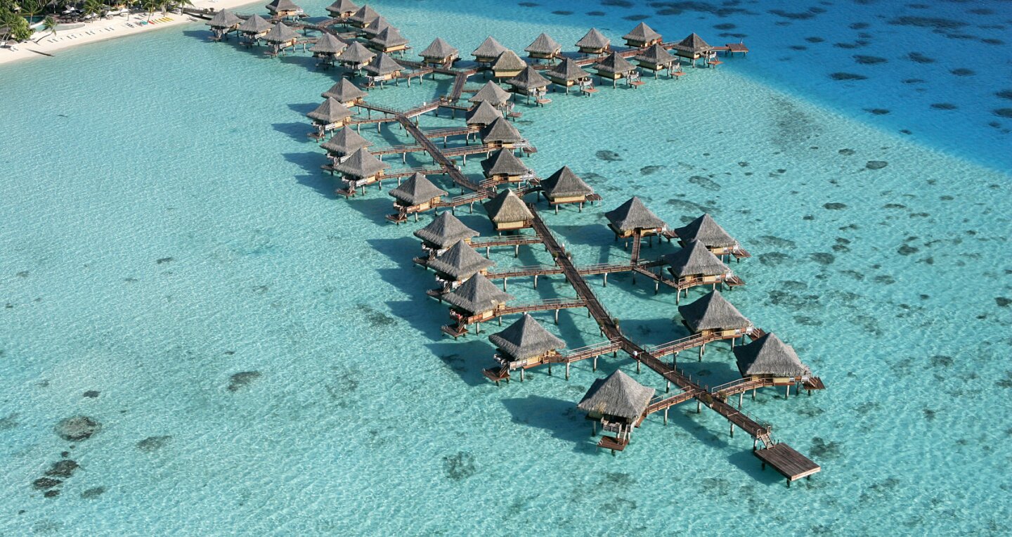 Above-water private bungalows make up the InterContinental Bora Bora Le Moana Resort, which overlook a turquoise shoreline