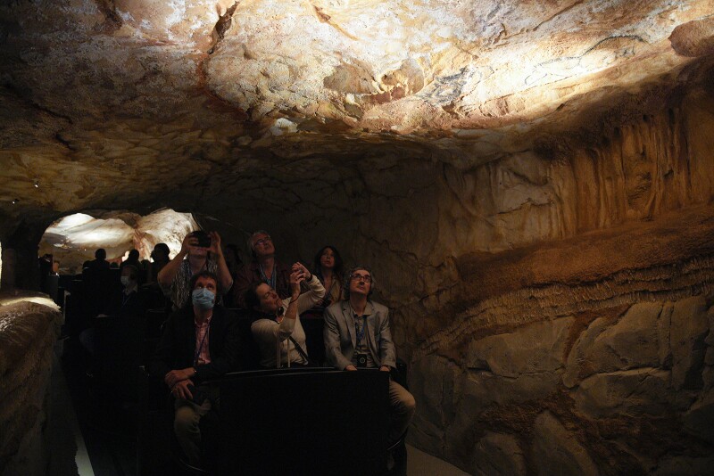 Journalists attend a preview tour before the opening of the replica of the Cosquer Cave.
