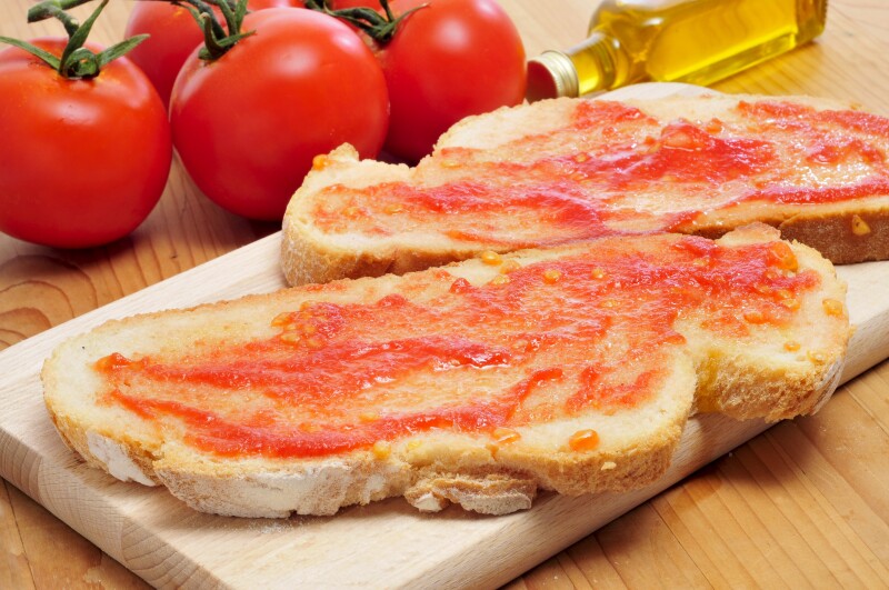 Slices of bread with tomato spread on top