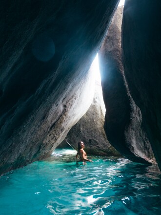 Wade in rock pools at the world-famous Baths on Virgin Gorda.