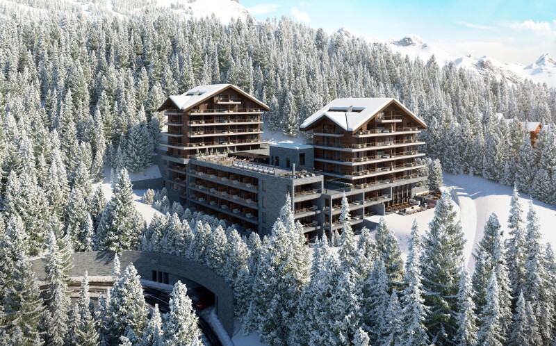 Exterior of Six Senses Crans-Montana resort, surrounded by snow-covered evergreens