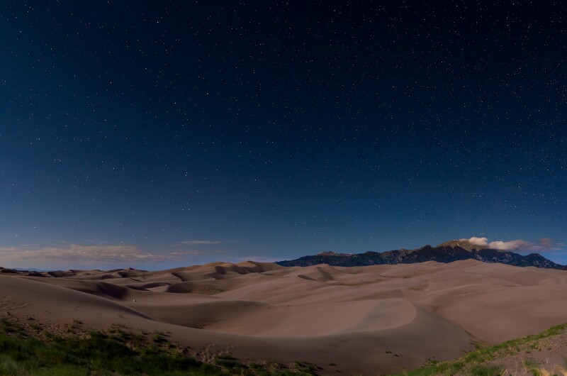 Stars over sands dunes at night