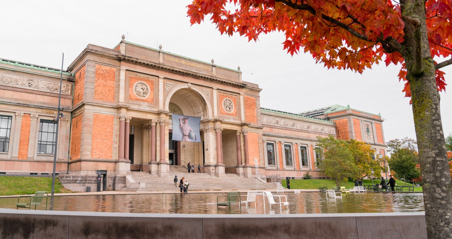 The decorative orange-pink brick and pale stone facade of the National Gallery – SMK in Copenhagen, Denmark