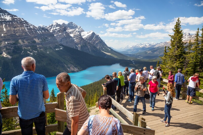 Tourists take in a view of Peyto Lake from an observation deck in Banff National Park.