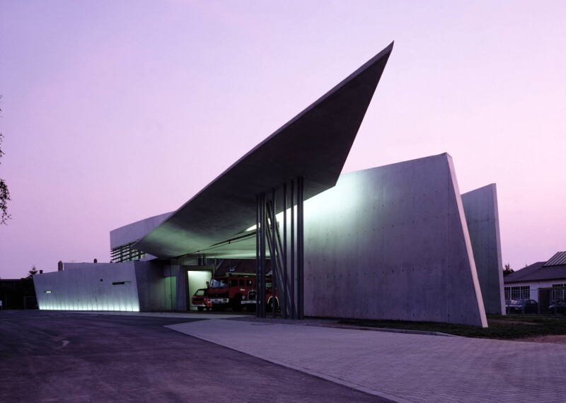 Angular exterior of concrete Vitra Fire Station at twilight