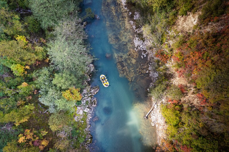 Aerial view of raft on river through forest in Bosnia and Herzegovina