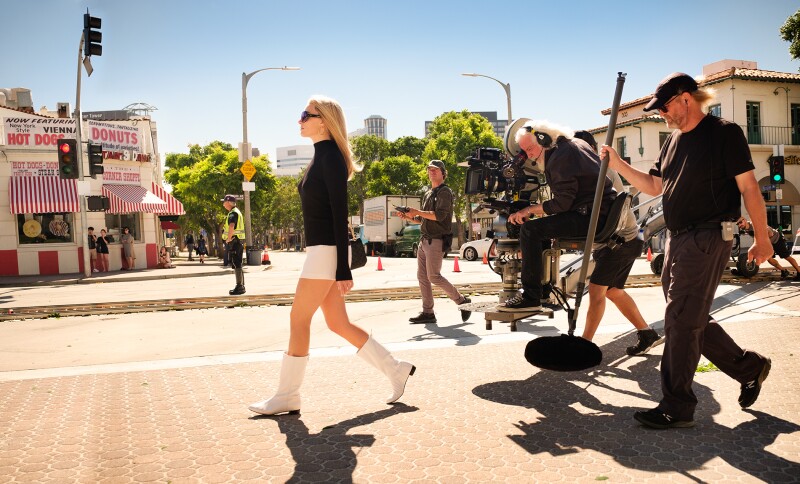 Margot Robbie gets into character as Sharon Tate on the “Once Upon a Time” film set in front of Stan’s Donuts.