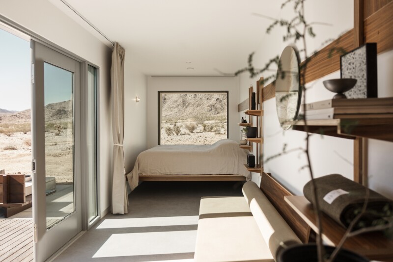 At reset, a private patio connects to the interior room, which is in a shipping container