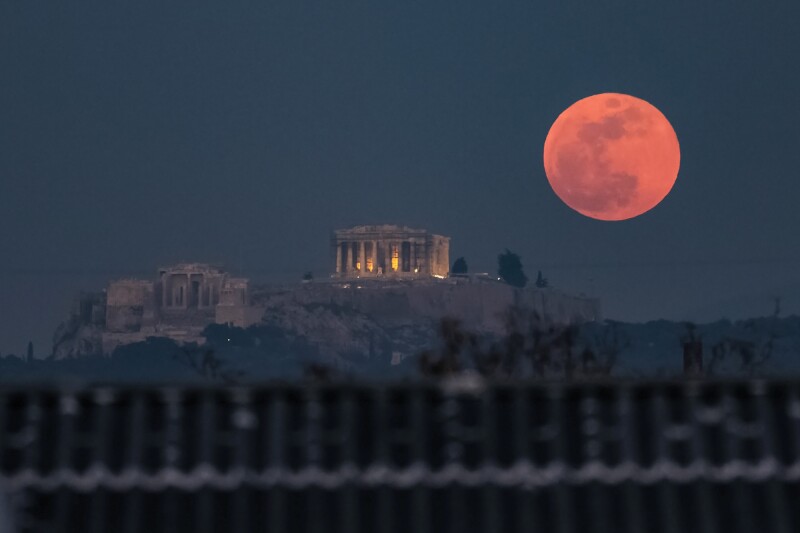 A super blood moon rises behind the Parthenon in Athens on January 31, 2018.