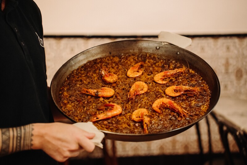 A pan of paella with shrimp on top in Barcelona