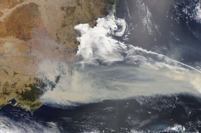 This January 2, 2020, photo shows thick smoke blanketing southeastern Australia along the border of Victoria and New South Wales. The smoke has also blown across the Tasman Sea into New Zealand, where skies are hazy and glaciers have turned brown.