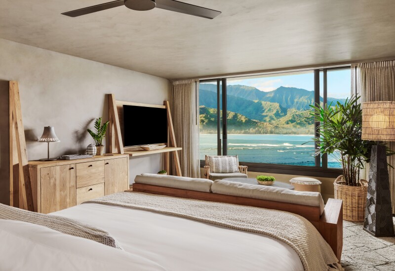 A bedroom with an ocean and mountain view at 1 Hotel Hanalei Bay