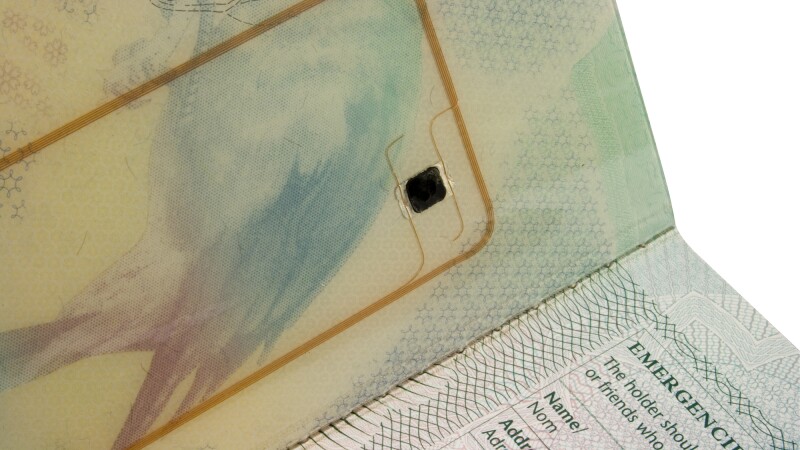 RFID chips, like this one embedded in the cover of a British passport, are similar to the I.D. chips implanted in pets.